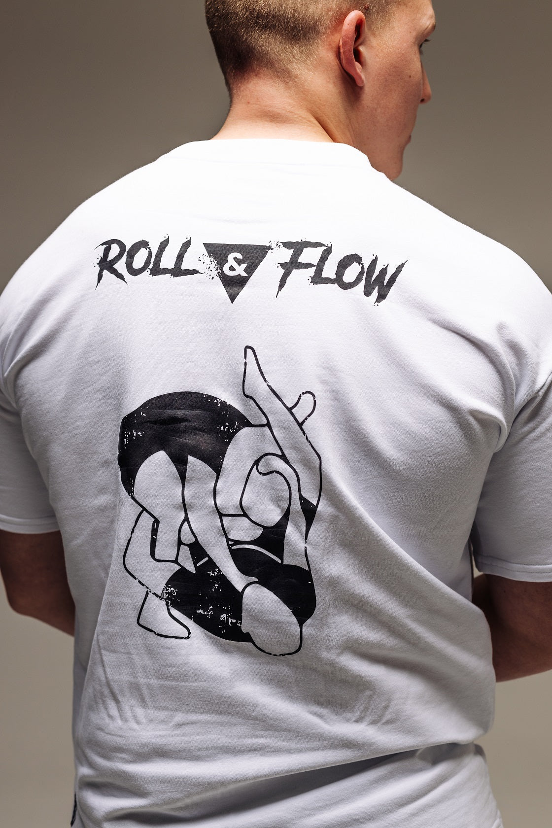 “Roll & Flow Oversized Triangle Choke Tee – Jiu-Jitsu Style”