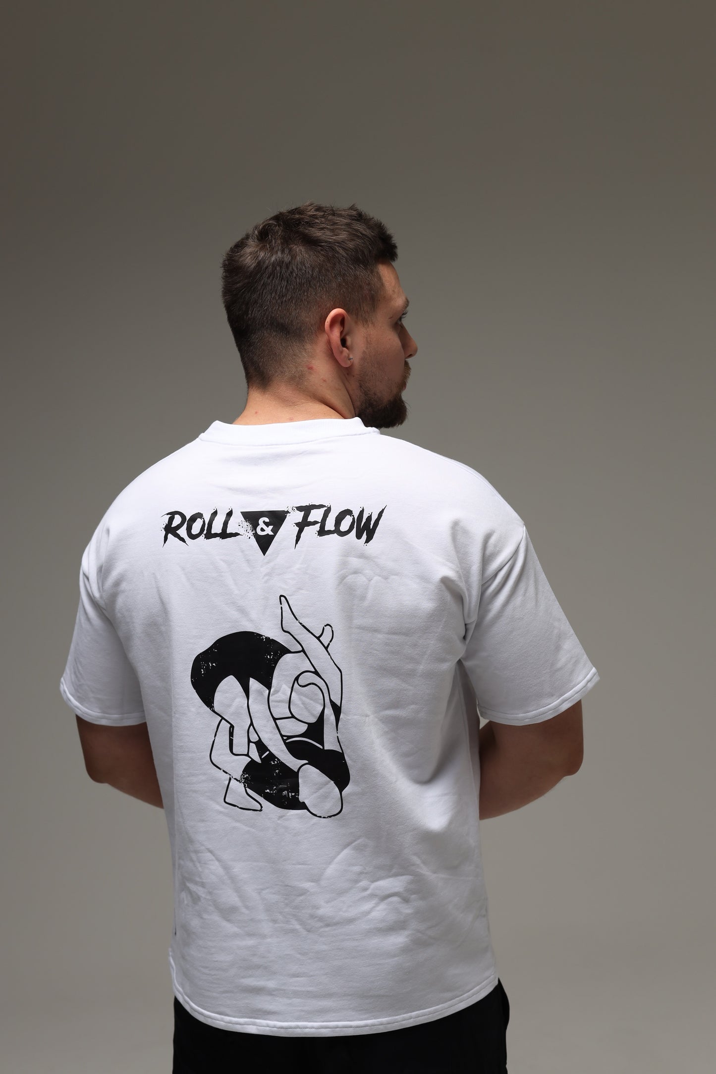 “Roll & Flow Oversized Triangle Choke Tee – Jiu-Jitsu Style”